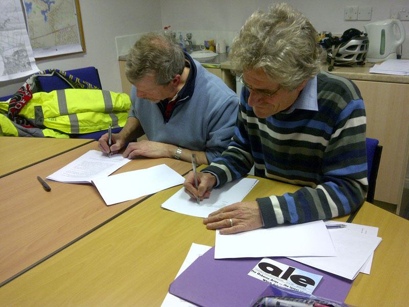 Max and Paul sign the licence